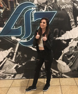 Sloane "Skipper" Wolfe gives the thumbs up in front of the CLG backdrop